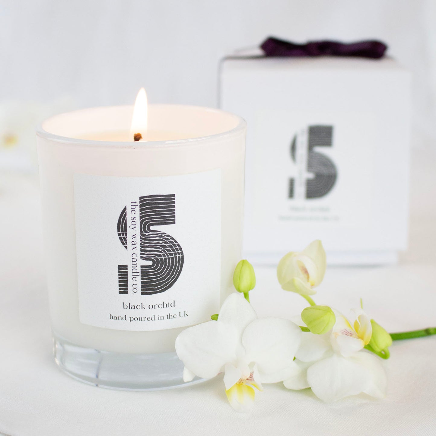 Black Orchid
Hand poured in the UK by The Soy Wax Candle Company, 20cl soy wax candle in white gloss jar with black orchid fragrance, luxury floral home fragrance candle gift