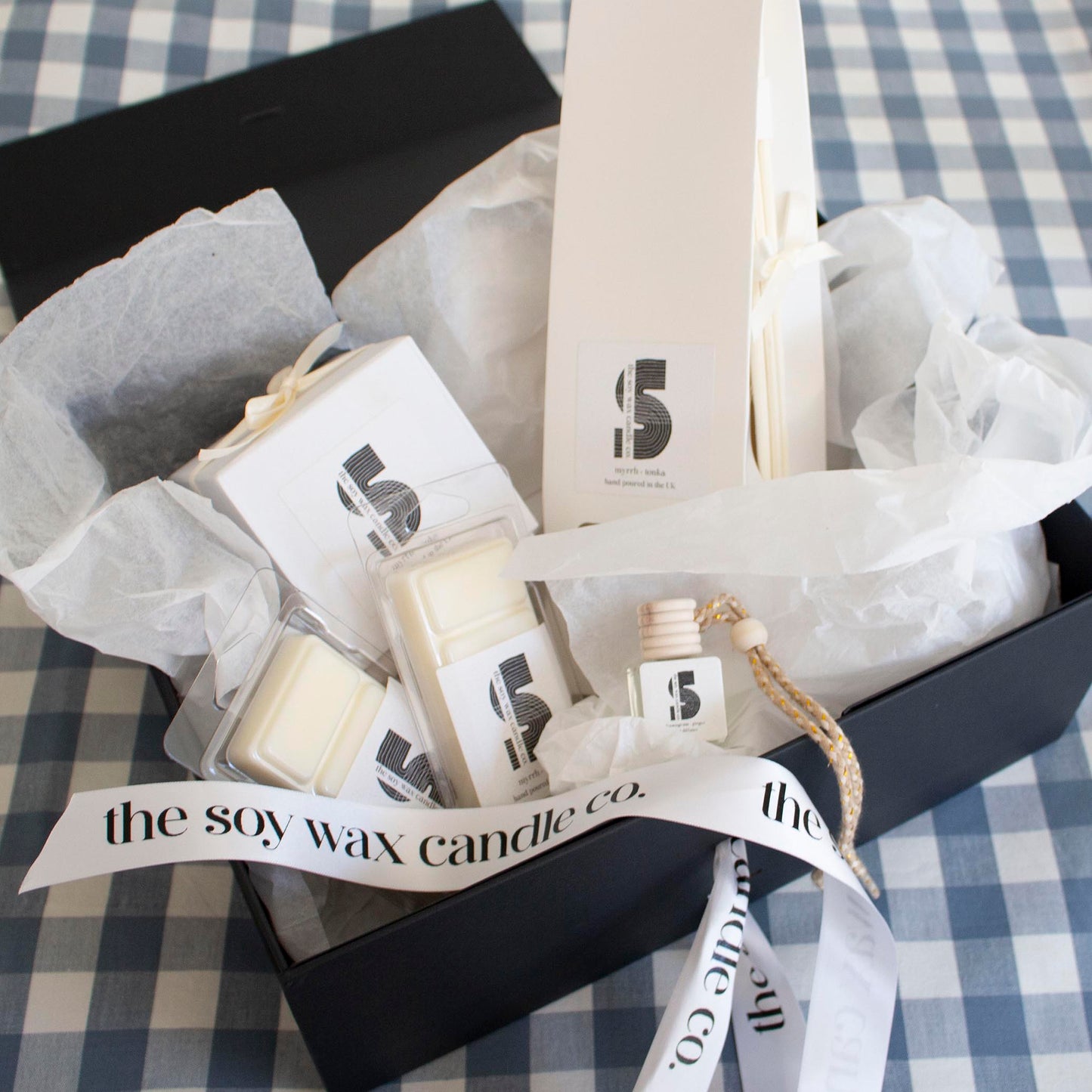 The Soy Wax Candle Company Floral Gift Hamper containing one soy wax candle, one reed diffuser, one car diffuser and 2 soy wax melt bars.  A luxurious gift!