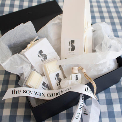 The Soy Wax Candle Company Floral Gift Hamper containing one soy wax candle, one reed diffuser, one car diffuser and 2 soy wax melt bars.  A luxurious gift!